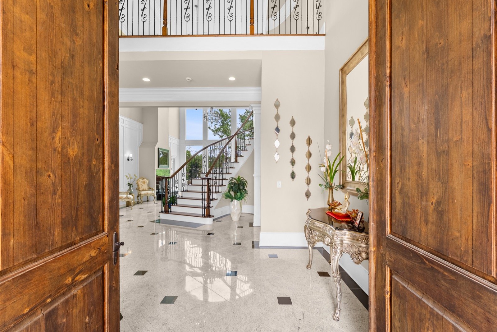 Grand foyer and staircase interior photo