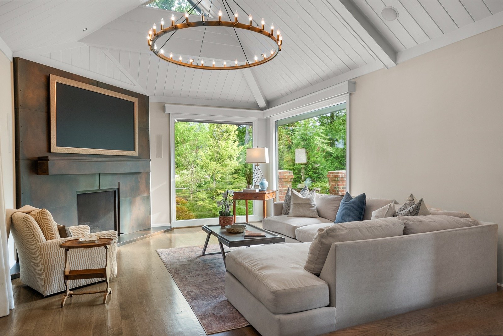 Vaulted living room with chandelier interior photo